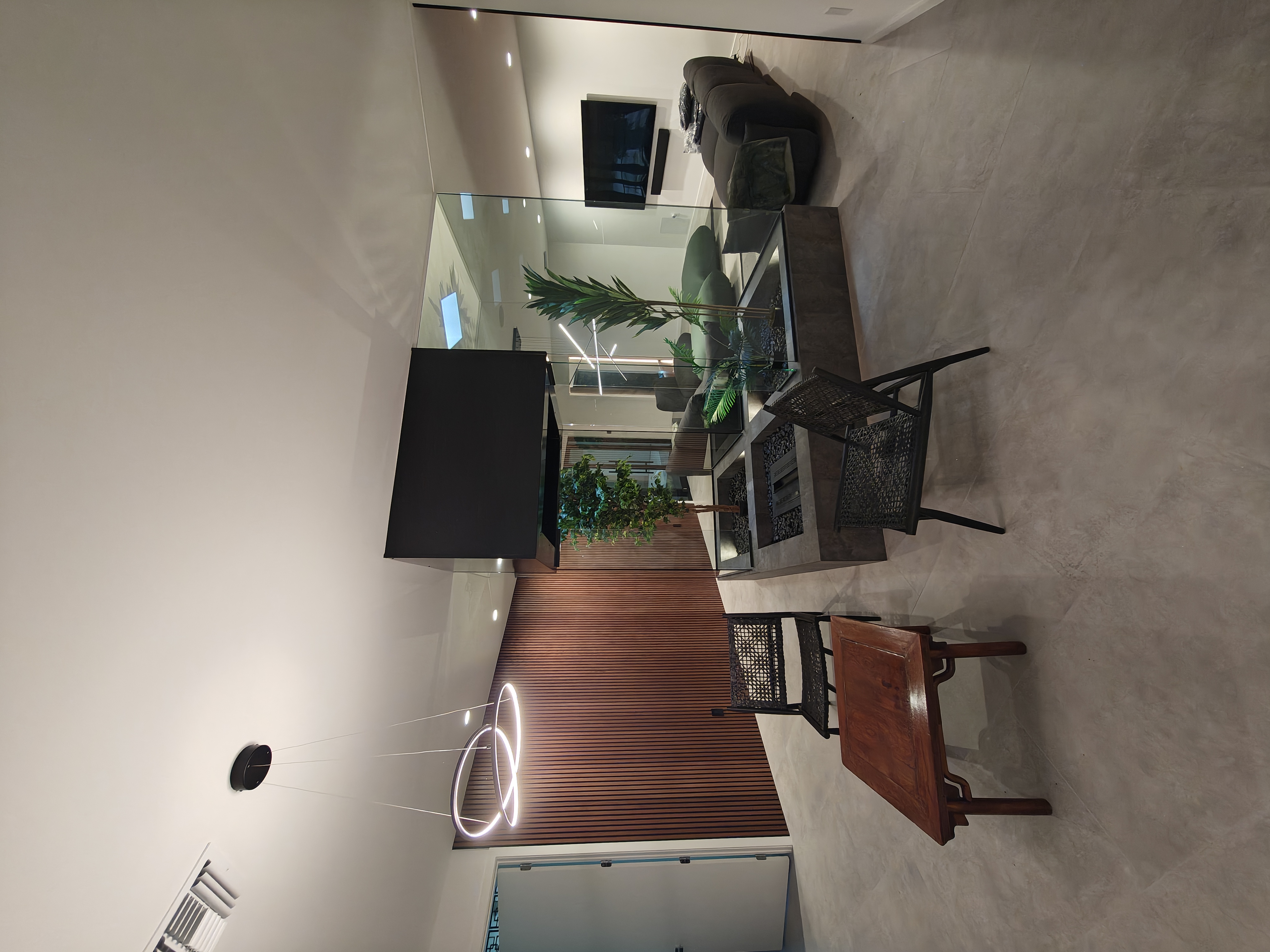 Sculptural ring pendant over an open-concept living and dining space
