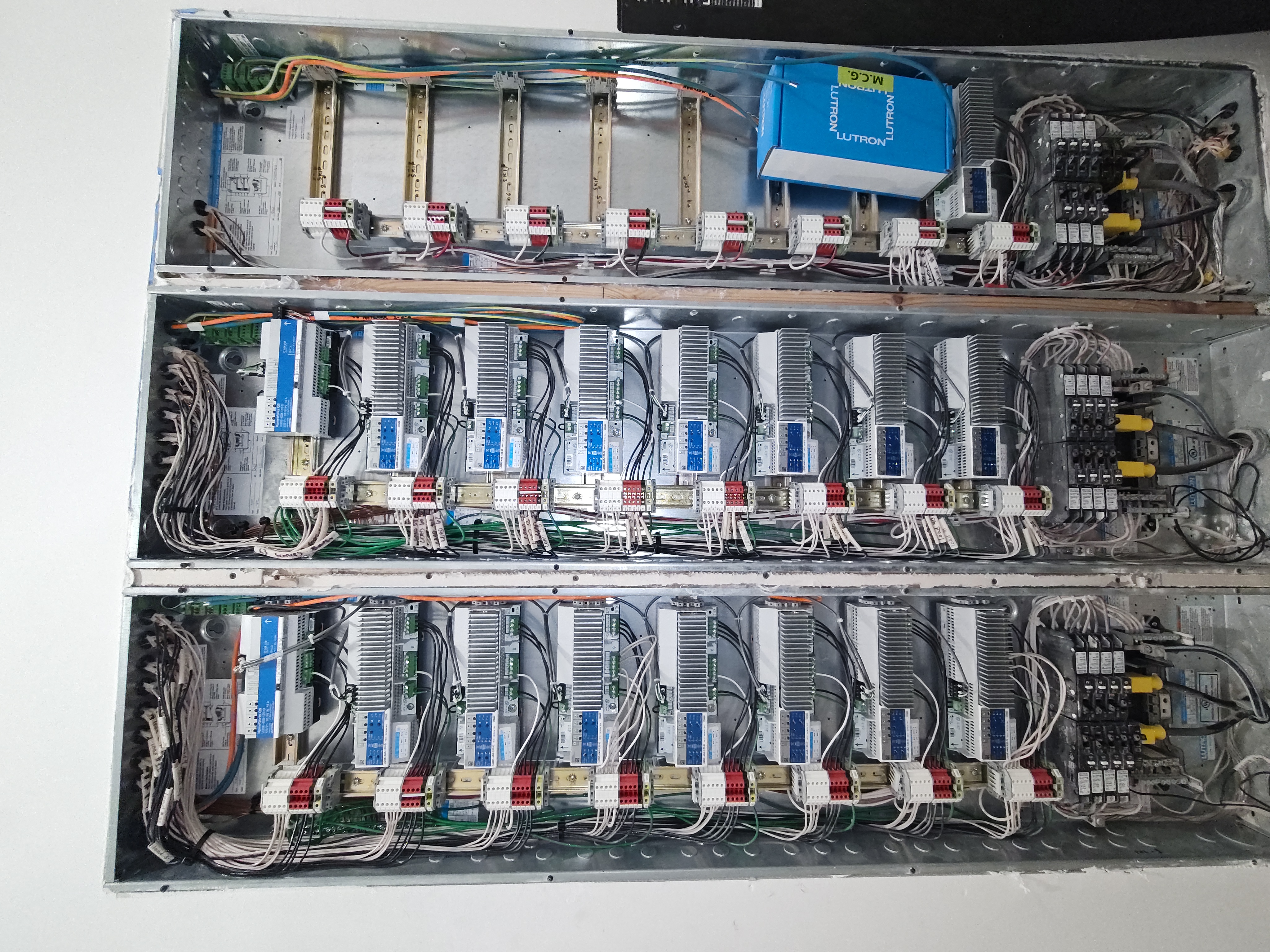 Lutron lighting control dimming panels wired in a commercial electrical room